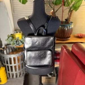 Sleek Black Leather Backpack with Textured Finish